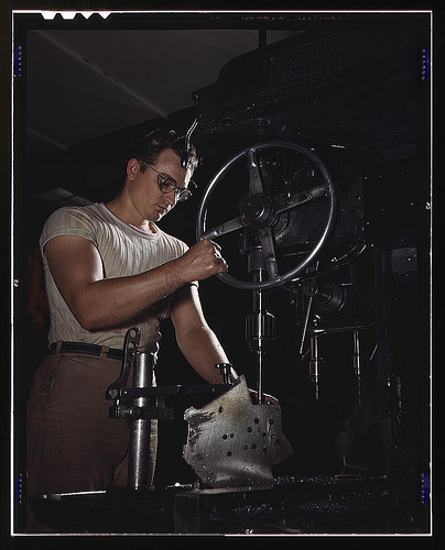 An employee in the drill-press section of North American’s huge machine shop runs mounting holes in a large dural casting, Inglewood, Calif. This plant produces the battle-tested B-25 (“Billy Mitchell”) bomber, used in General Doolittle’s raid on Tokyo, a