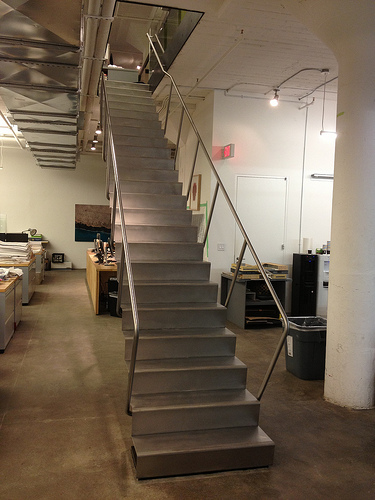 Blackened steel stair with stainless treads