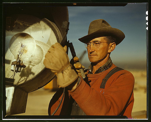 Servicing a single of the floodlights that turn night into day at the large construction operations for a new steel plant which will make essential additions to the vast quantity of steel needed for the war effort, Columbia Steel Co., Geneva, Utah (LOC)